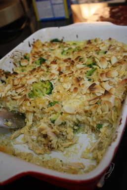 Cheesy broccoli, chicken and rice gratin with crisp almonds