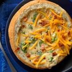 Cheesy broccoli soup in a bread bowl