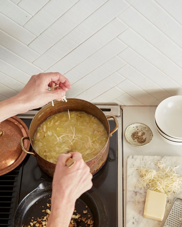 Cheesy cabbage and white bean soup