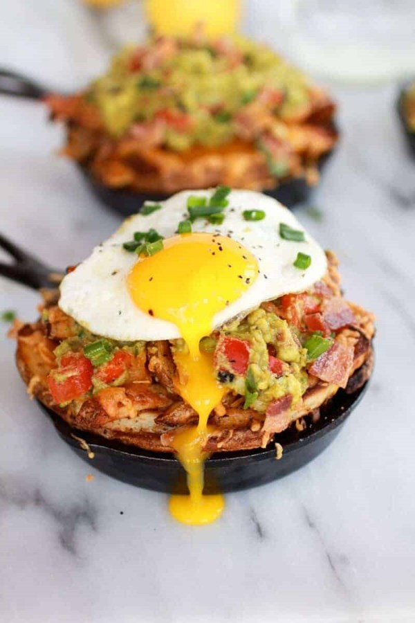 Cheesy Cajun fries with Cajun guacamole, bacon and fried eggs