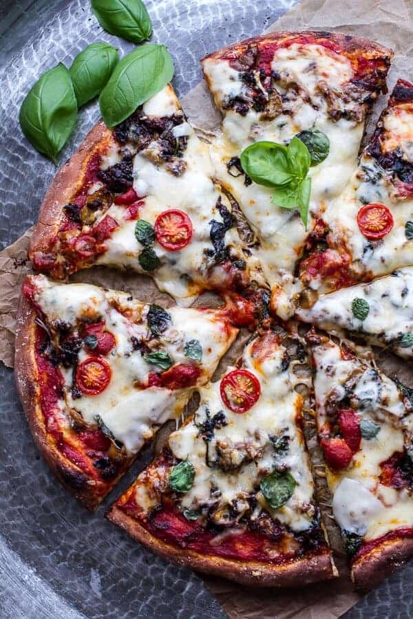 Cheesy Fontina caramelized onion and chorizo spinach + artichoke pizza