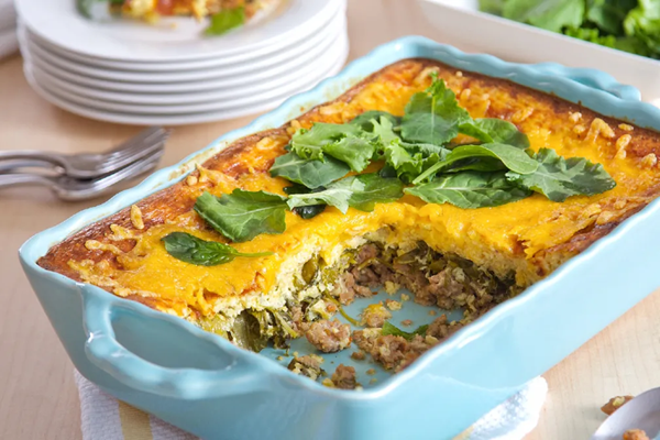 Cheesy grits casserole with sausage & greens