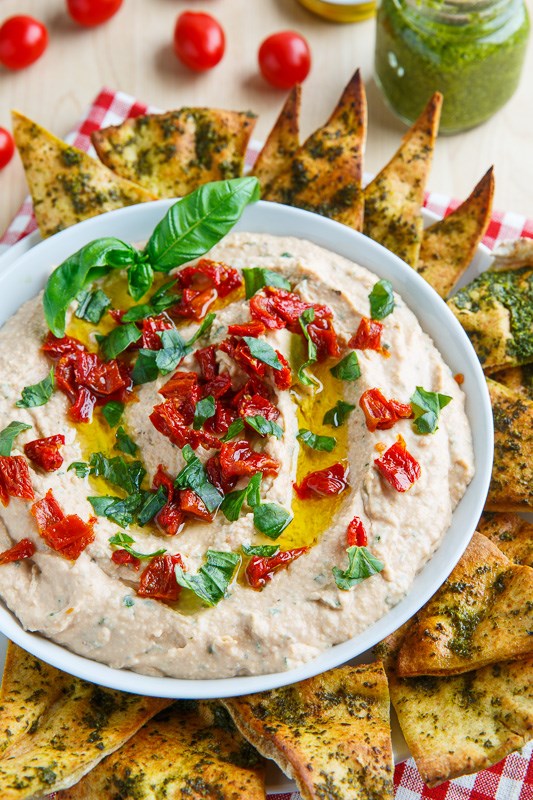 Cheesy Margherita pizza hummus with pesto pita chips
