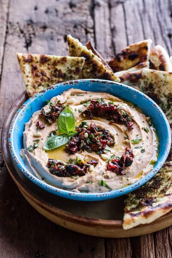 Cheesy Margherita pizza hummus with grilled pesto pizza bread