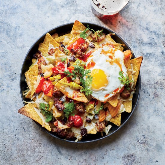 Cheesy nachos with fried eggs and giardiniera