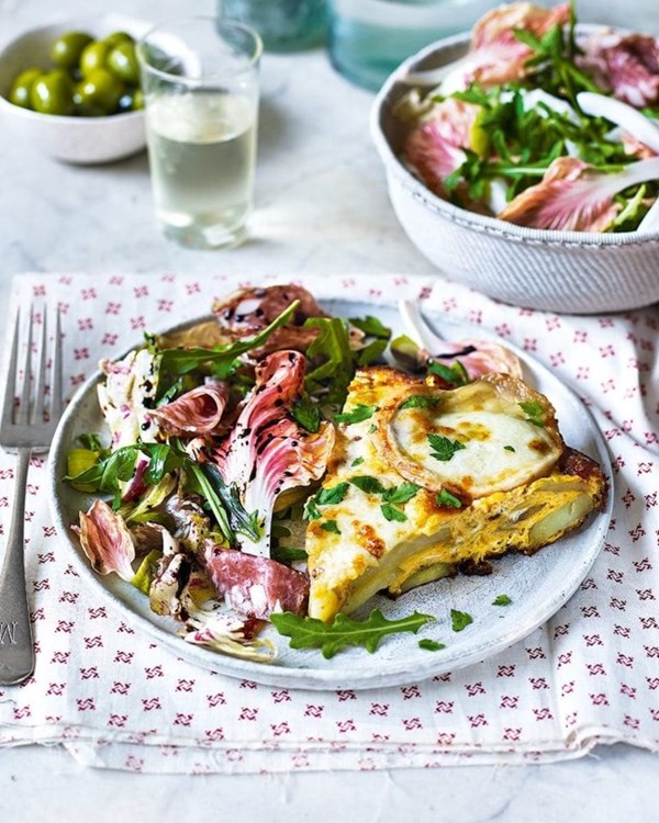 Cheesy potato frittata with radicchio, salami and olive salad