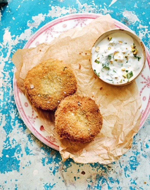 Cheesy risotto cakes with herbed pistachio yoghurt