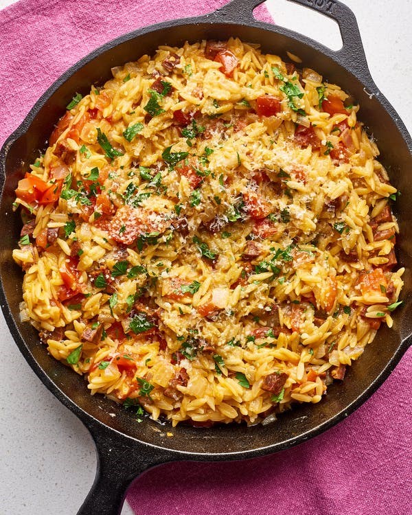 Cheesy tomato chorizo orzo skillet