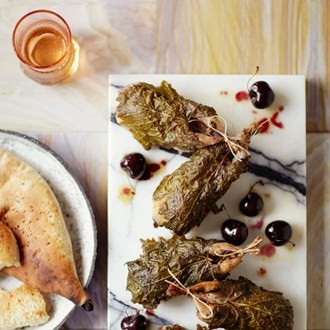 Cherry-and-rice-stuffed quails in vine leaves