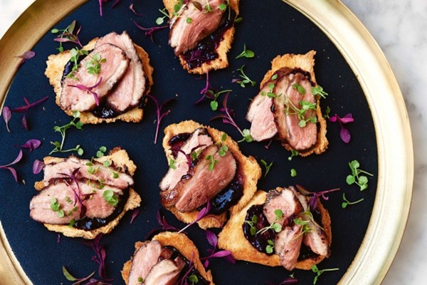 Cherry-glazed duck breast on brioche toasts