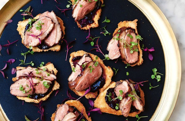Cherry-glazed duck breast on brioche toasts