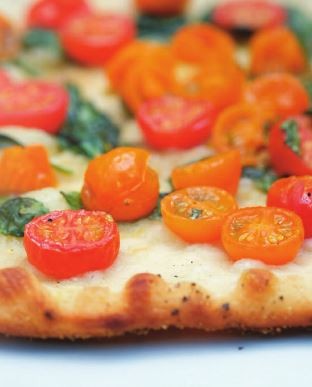 Cherry tomato and frizzled herb pizza