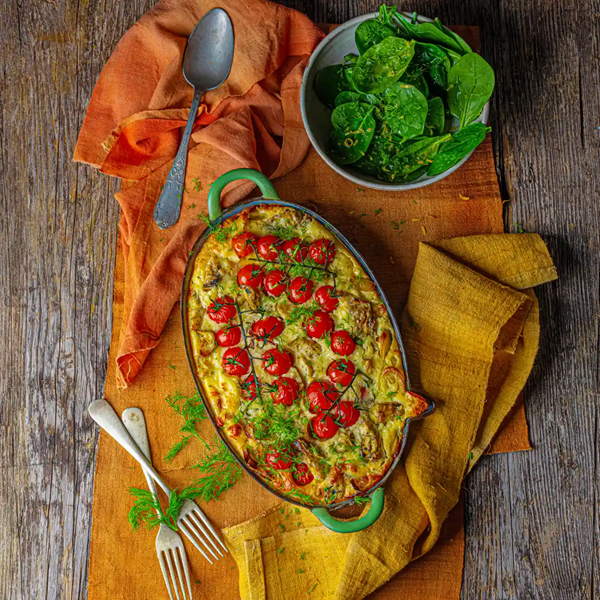 Cherry tomato. leek and artichoke bake with feta
