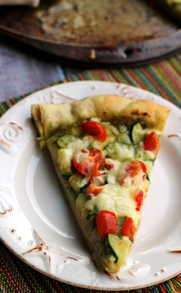 Cherry tomato, zucchini, and pesto pizza
