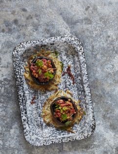 Chestnut-stuffed mushrooms on potato rostis