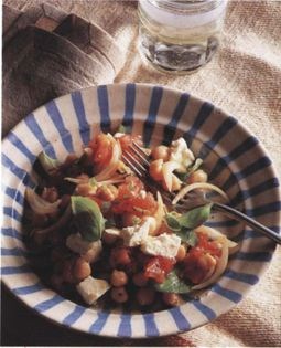 Chick pea, feta cheese and tomato salad with green chilli and lemon dressing