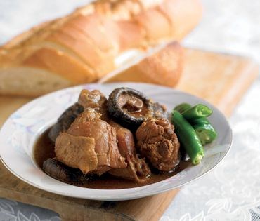 Chicken and dried mushrooms simmered in fermented soy bean paste (Ayam kombak)