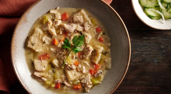Chicken and dumplings with cucumber and onion salad [Khela Brewer]