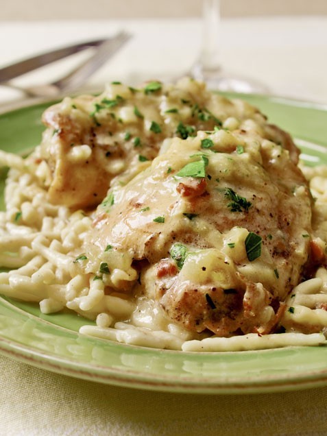 Chicken and onions braised in a creamy wine sauce