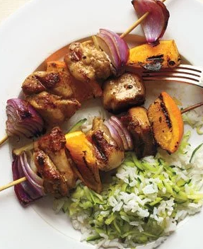 Chicken and orange skewers with zucchini rice