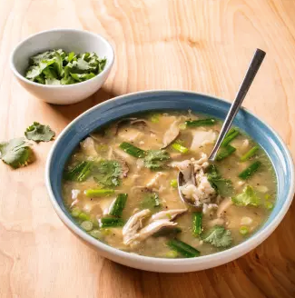 Chicken and rice soup with ginger and scallions