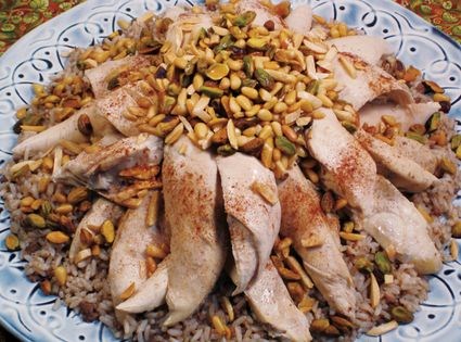 Chicken and spiced rice with toasted nuts (Djeaj ma riz haswi)