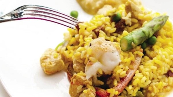 Chicken, asparagus and crayfish paella with almond alioli