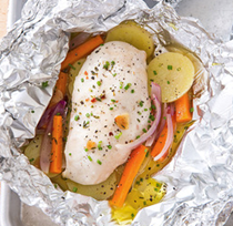 Chicken baked in foil with potatoes and carrots