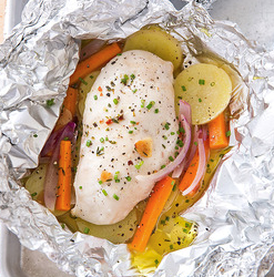 Chicken baked in foil with potatoes and carrots