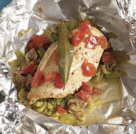 Chicken breasts en papillotes with celery, bay leaf, and tomato