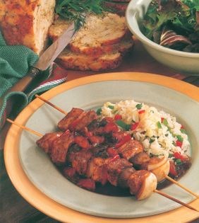 Chicken brochettes with vegetable rice