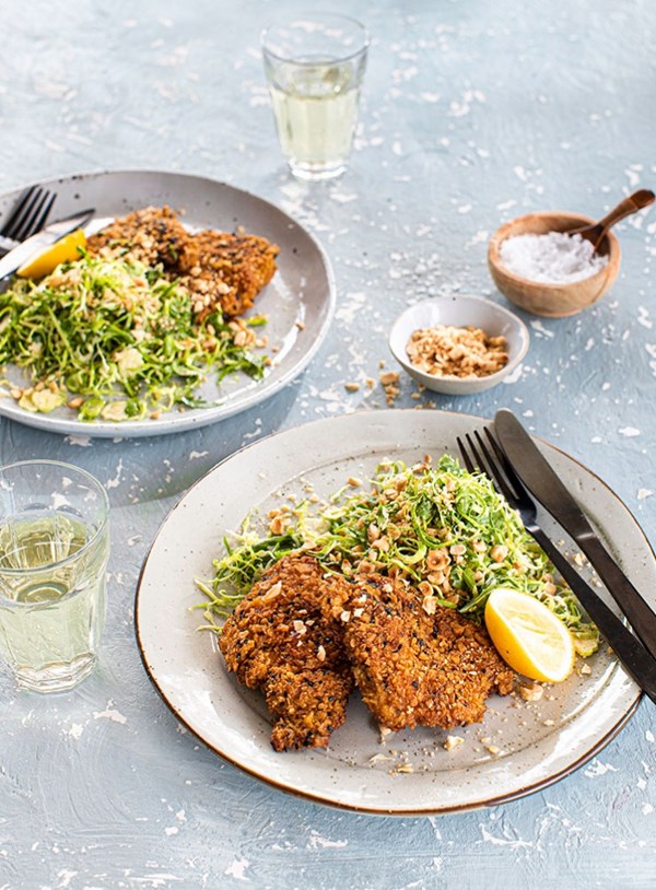 Chicken cotoletta with Brussels sprouts, rocket and hazelnut salad