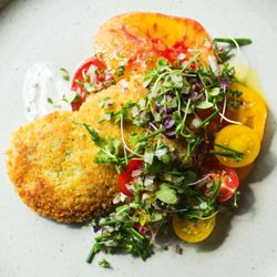 Chicken cotoletta with heritage tomatoes and olives