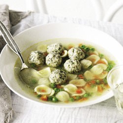 Chicken dumpling soup with orecchiette and peas