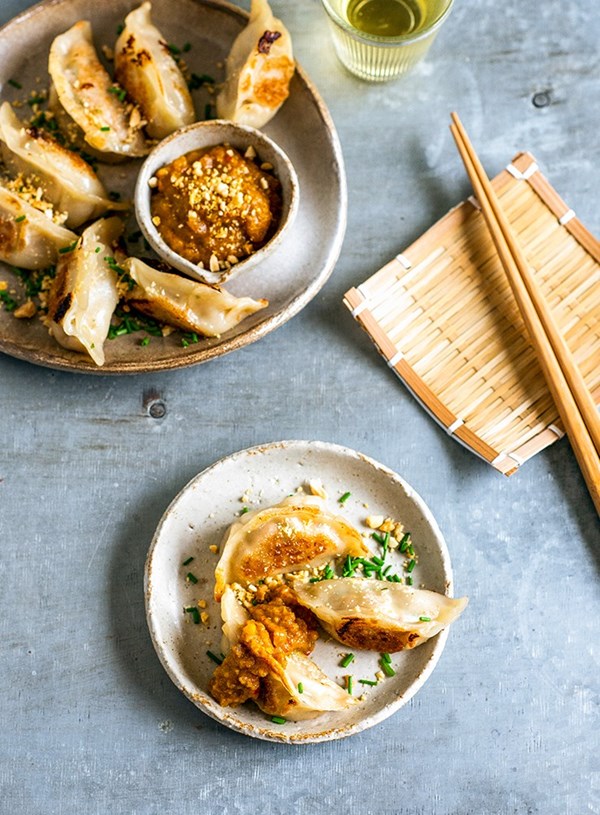 Chicken dumplings with spicy peanut sauce