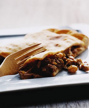 Chicken empanada with chorizo, raisins, and olives