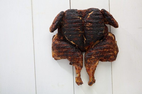 Chicken grilled under a brick