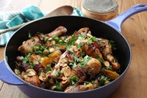 Chicken legs with caperberries, raisins, green olives and roasted almonds