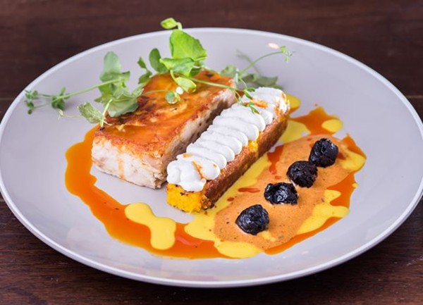 Chicken pachamanca with yellow cuzco corn and Pisco-infused prunes