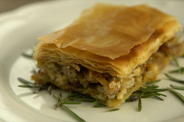 Chicken pie with raisins, pine nuts, herbs, and two Greek cheeses (Kotopita me koukounaria, stafides, myrodika kai tyria)