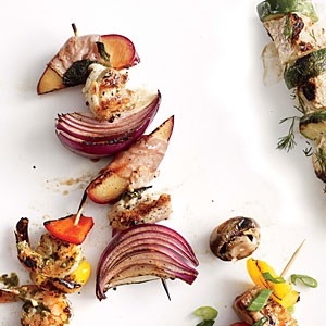 Chicken, red onion, and prosciutto-wrapped plum kebabs