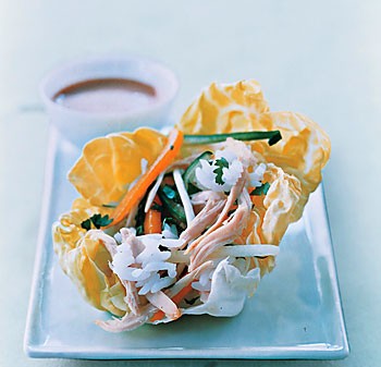 Chicken, rice, and mango in lettuce wraps