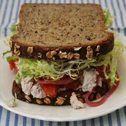 Chicken salad, walnuts, roasted tomatoes, pickled red onions, and frisée on multigrain bread