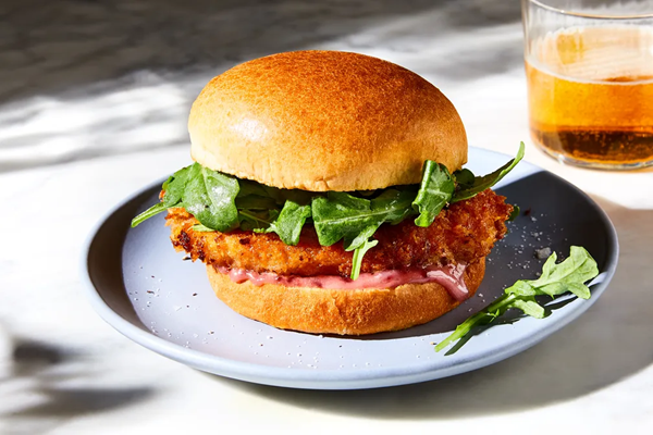Chicken schnitzel sandwich with lemony arugula & berry mayo