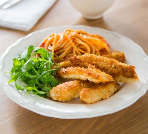 Chicken schnitzel strips with tomato spaghetti
