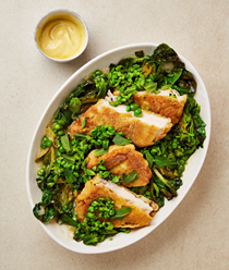 Chicken schnitzel with braised peas and pea salsa