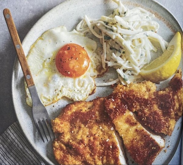Chicken schnitzel with celeriac remoulade and a fried egg