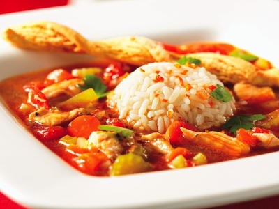 Chicken soup with tomatoes, wine and orange