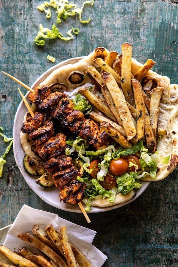 Chicken souvlaki bowls with garlic fries