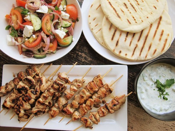 Chicken souvlaki with tzatziki sauce and Greek salad